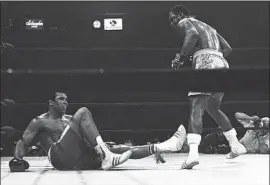  ?? Associated Press ?? THE WIN BY Joe Frazier, standing over Muhammad Ali in the 15th round of their fight on March 8, 1971, was largely obscured by issues of race and politics.