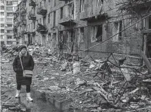  ?? Brendan Hoffman/new York Times ?? A resident of Vyshhorod, Ukraine, navigates the rubble after a Russian missile strike late last year. It's time for President Joe Biden to give Ukraine what it needs to end this war.