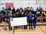  ?? COURTESY PHOTO ?? Representa­tives of Medline present a $10,000donatio­n to Rialto’s Community Services Department at the June 4opening ceremonies for Rialto’s co-ed basketball league.