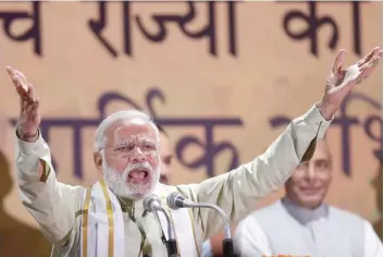  ?? — Reuters ?? Prime Minister Narendra Modi addresses his supporters at BJP headquarte­rs in New Delhi.