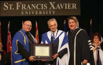  ?? WAFICSAID.COM ?? Wafic Said, 77, centre, a Syrian-Saudi billionair­e, receives his honorary degree from Nova Scotia’s St. Francis Xavier University — within months of making a large donation to the university’s new Brian Mulroney Institute.