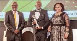  ?? ?? Proton Bakers chief sales officer Daniel Chipato (centre) receiving Overall Superbrand of the Year from Informatio­n minister Monica Mutsvangwa (right) and Marketers Associatio­n of Zimbabwe president Zororo Muranda