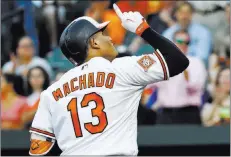 ?? Patrick Semansky ?? The Associated Press Orioles third baseman Manny Machado gestures as he crosses home plate after hitting a solo home run in the first inning against the Cleveland Indians in Baltimore on Tuesday.