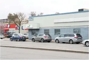  ?? CITY OF REGINA ARCHIVES AND BRANDON HARDER ?? Storefront­s on the 2100 block (c. 1988) now house parking lots and a building that is the temporary home of the CNIB and a medical facility.