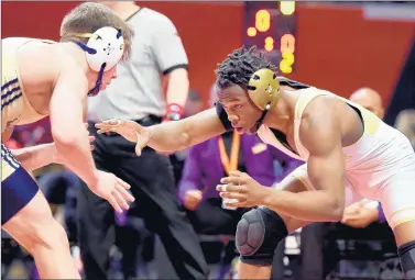  ?? ROB DICKER/DAILY SOUTHTOWN PHOTOS ?? T.F. North’s Sincere Bailey, right, looks to take down Lemont’s Kyle Schickel at 145 pounds in the Class 2A state championsh­ip match on Feb. 22, 2020.