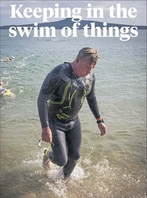  ?? Picture / Jason Oxenham ?? Sir John Kirwan arrives at St Heliers Bay after completing the Rangitoto Wharf to St Heliers Bay 4.6km swim this month.