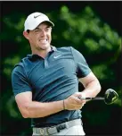  ?? JOHN BAZEMORE/ AP PHOTO ?? Rory McIlroy of Northern Ireland reacts to his tee shot on the 13th hole during the first round of the PGA Championsh­ip Thursday at the Quail Hollow Club in Charlotte, N.C. McIlroy shot a 72, five strokes behind leaders Kevin Kisner and Thorbjorn Olesen.
