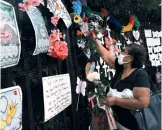  ??  ?? Memorials hang at Greenwood Cemetery to remember and celebrate the lives of those killed in the COVID-19 pandemic