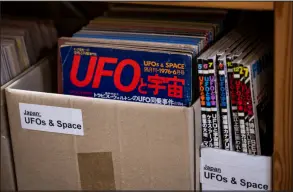  ?? ?? Books and a poster on UFOs are displayed at the Archives for the Unexplaine­d (AFU) in Norrkoping, Sweden.