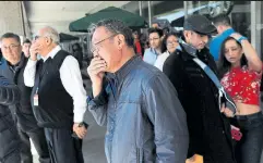  ?? RENÉ JOHNSTON/TORONTO STAR ?? Distraught bystanders gather outside a North York Centre café.