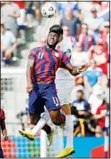  ?? (AP) ?? U.S. forward Daryl Dike (11) and Canada defender Steven Vitoria go up for the ball during the first half of a CONCACAF Gold Cup soccer match in Kansas City, Kan., on July 18.