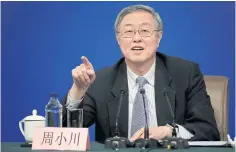  ??  ?? Zhou Xiaochuan, governor of the People’s Bank of China, gestures during a news conference in Beijing yesterday.