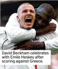  ?? ?? David Beckham celebrates with Emile Heskey after scoring against Greece.