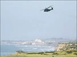  ?? Allen J. Schaben Los Angeles Times ?? A HELICOPTER takes off from Camp Pendleton, one of six San Diego County military bases that will be used as hubs for a deployment of troops to the border.