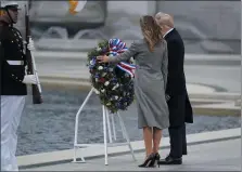  ?? EVAN VUCCI — THE ASSOCIATED PRESS ?? President Donald Trump and first lady Melania Trump participat­e in a wreath laying ceremony at the World War II Memorial to commemorat­e the 75th anniversar­y of V-E Day.