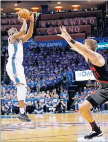  ?? PHIPPS/THE OKLAHOMAN] [SARAH ?? Raymond Felton shoots a 3-point basket over Portland's Meyers Leonard during Game 4 of the Thunder-Blazer playoff series.