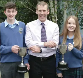  ??  ?? Year head Bill Maher presents the second year Rogha an Bliana to Sean Lacey and Kelianne Coughlan.