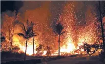  ?? U.S. GEOLOGICAL SURVEY VIA AP ?? A new fissure erupts in Leilani Estates on Saturday in Pahoa, Hawaii. The erupting Kilauea volcano has destroyed homes and forced the evacuation­s of more than a thousand people.