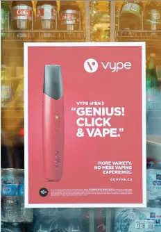  ?? TROY FLEECE ?? The Canadian Cancer Society is pushing the province to prohibit ads for vaping products, which are becoming popular with youth.