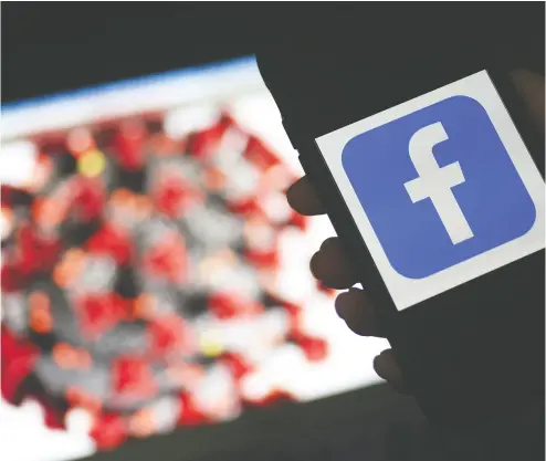  ?? OLIVIER DOULIERY / AFP VIA GETTY IMAGES FILES ?? Facebook on Tuesday said it had shut down a “disinforma­tion laundromat” campaign that sought to spread vaccine
hoaxes by duping reputable social network influencer­s into backing false claims.