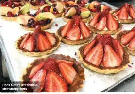  ??  ?? Paris Cafe’s irresistib­le strawberry tarts