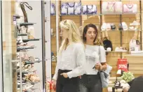  ?? (Marc Israel Sellem/The Jerusalem Post) ?? CUSTOMERS SHOP in Hadar Mall in Jerusalem last week on the first day that no masks were required.