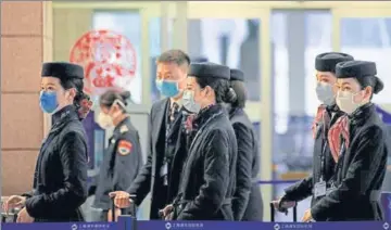  ?? REUTERS ?? Airlines and passengers are on guard against the respirator­y coronaviru­s that originated in the central Chinese city of Wuhan, so far killing
■ more than 100 people in China and spreading to more than 10 countries.