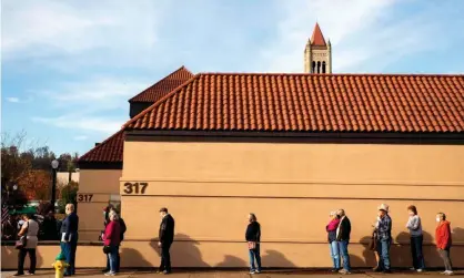  ??  ?? Early voters line in Parkersbur­g, West Virginia, on 21 October. Photograph: Stephen Zenner/AFP/Getty Images