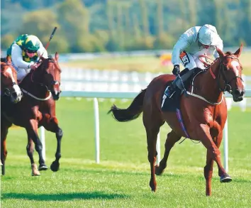  ?? Rex Features ?? Communique, ridden by Silvestre de Sousa, wins The Dubai Duty Free Handicap Stakes at Newbury Racecourse yesterday.