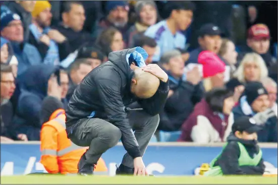  ??  ?? Manchester City’s head coach Pep Guardiola reacts after a missed chance to score during the English League Cup semifinal second leg soccer match between Manchester City and Manchester
United at Etihad Stadium in Manchester, England on Jan 29, 2020. (AP)