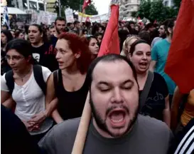  ?? AP ?? GREEK SUPPORTERS OF ‘NO’ VOTE Demonstrat­ors stage a rally in the northern port city of Thessaloni­ki to support the “No” vote on the referendum on Sunday on the creditors’ demands for more austerity in exchange for bailout funds to keep Greece solvent.