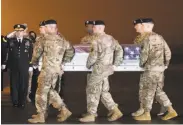  ?? Steve Ruark / Associated Press ?? The remains of Maj. Brent Taylor received military honors upon arrival at Dover Air Force Base, Del.