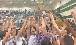  ?? SEBASTIAN MONDACA/ARIZONA REPUBLIC ?? AZ College Prep celebrates with the 4A championsh­ip trophy after defeating Northwest Christian.