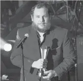  ?? AMY HARRIS/INVISION ?? Luke Combs accepts the Gene Weed Milestone Award at the annual ACM Honors on Wednesday.