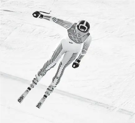  ??  ?? Lindsey Vonn races down the mountain at Jeongseon Alpine Centre en route to posting a bronze medal-winning time in the downhill. MICHAEL MADRID/USA TODAY SPORTS