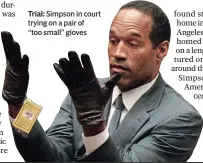  ?? ?? Trial: Simpson in court trying on a pair of
“too small” gloves