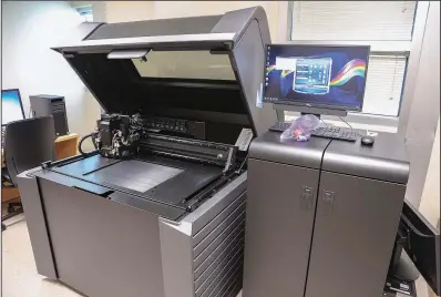  ?? Special to the Democrat-Gazette ?? A 3-D printer used by Arkansas Children’s Hospital to print organ replicas to assist in planning surgeries is shown Friday.