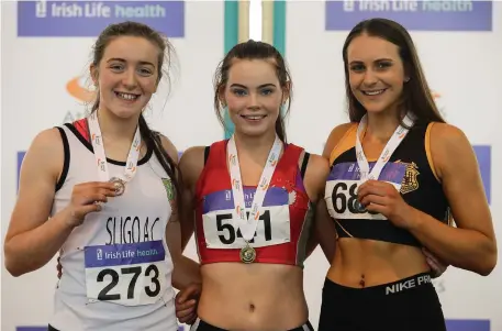  ??  ?? U18 Girl’s 200m medallists, from left, Lauren Cadden of Sligo AC, bronze, Lauren Roy of City of Lisburn AC, Co Antrim, gold and Ciara Deely of Kilkenny City Harriers, silver, during the Irish Life Health Juvenile Indoor Championsh­ips 2017 at the AIT...