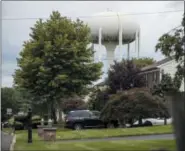  ?? MATT ROURKE — THE ASSOCIATED PRESS ?? A water tower stands above a residentia­l neighborho­od in Horsham, Pa. In Horsham and surroundin­g towns in eastern Pennsylvan­ia, and at other sites around the United States, the foams once used routinely in firefighti­ng training at military bases contained per-and polyfluoro­alkyl substances, or PFAS. EPA testing between 2013and 2015 found significan­t amounts of PFAS in public water supplies in 33U.S. states.