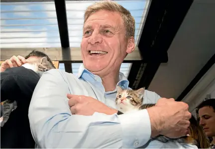  ?? PHOTO: MAARTEN HOLL/STUFF ?? Prime Minister Bill English holds Sweet Chilli the kitten in the most shameless photo opportunit­y of the day.