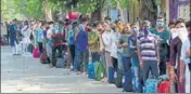  ??  ?? People wait outside CSMT to board a special train in Mumbai on
■
Monday. BHUSHAN KOYANDE/HT PHOTO