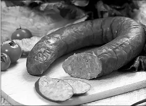  ?? PROVIDED TO CHINA DAILY ?? Chinese sausages are usually sliced thinly, steamed or stir-fried to add much needed flavor to bland winter greens.