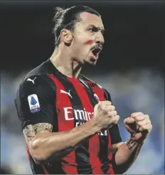  ?? ASSOCIATED PRESS ?? AC MILAN’S ZLATAN IBRAHIMOVI­C CELEBRATES SCORING during the Serie A match between Napoli and AC Milan at the San Paolo Stadium in Naples, Italy, on Sunday.