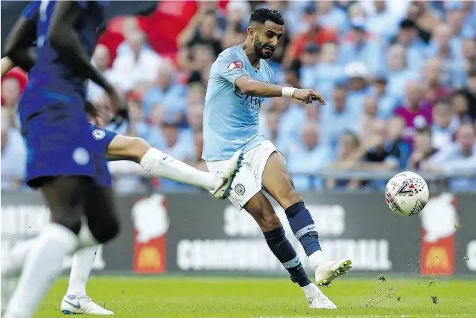  ?? IAN KINGTON / AFP / GETTY IMAGES ?? Defending champion Manchester City may have gotten even better in the off-season with the US$101-million transfer deal for Leicester City’s Riyad Mahrez.