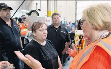  ??  ?? SEN. CLAIRE McCASKILL (D-Mo.), right, criticized Trump’s tariffs when she toured the plant last week.