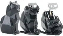  ??  ?? This cute black cat candle melts to reveal a metallic cat skeleton. Available at Hot Topic at Bayshore for $34.50.