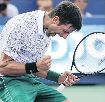  ?? THE ASSOCIATED PRESS ?? Novak Djokovic reacts after defeating Roger Federer in the men’s singles final at the Western &amp; Southern Open. Djokovic is now 12-6 overall against his old rival in championsh­ip matches.