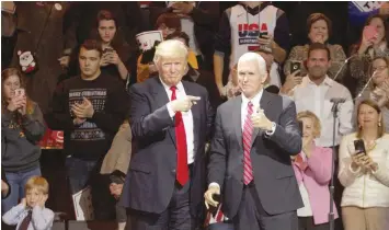  ?? — Reuters ?? Donald Trump and Vice-President-elect Mike Pence hold a rally in Cincinnati as part of their “USA Thank You Tour 2016”.