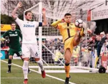  ??  ?? Sutton United striker Maxime Biamou controls the ball as Leeds United defender Liam Cooper (left) reacts during yesterday’s English FA Cup 4th round match at the Borough Sports Ground in London. –