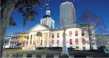  ?? STEPHEN M. DOWELL/ORLANDO SENTINEL ?? The Florida Capitol in Tallahasse­e is pictured on Jan. 16. House Speaker Chris Sprowls and Senate President Wilton Simpson unveiled the plan Wednesday and touted it as a way to help businesses by giving them a tax break that would allow them to hire back workers laid off during the pandemic more quickly.